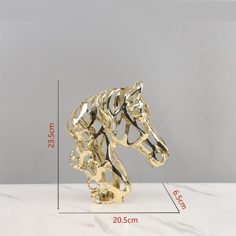 Gold horse head sculpture with measurements on a gray background