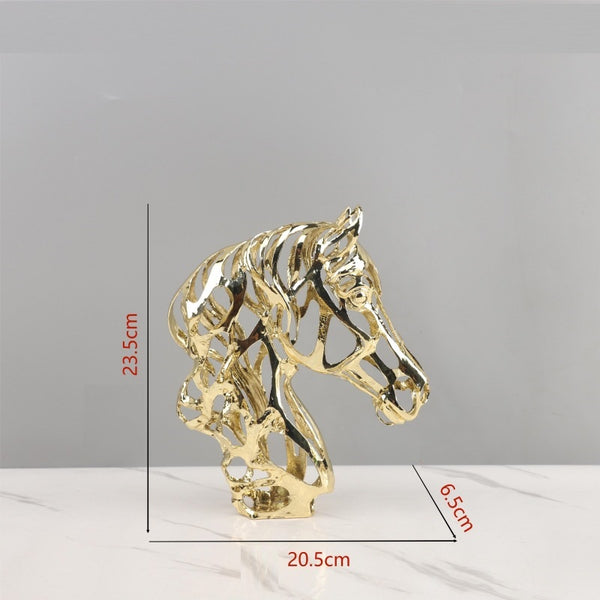 Gold horse head sculpture with measurements on a gray background