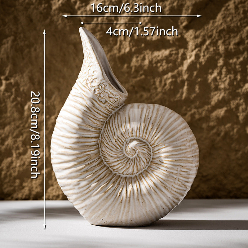 Decorative shell-shaped vase with measurements on a textured background