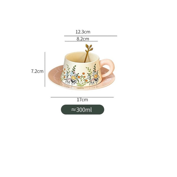 Ceramic cup with floral design and saucer, shown with measurements on a white background